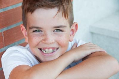 Young boy with braces smiling, south charlotte nc
